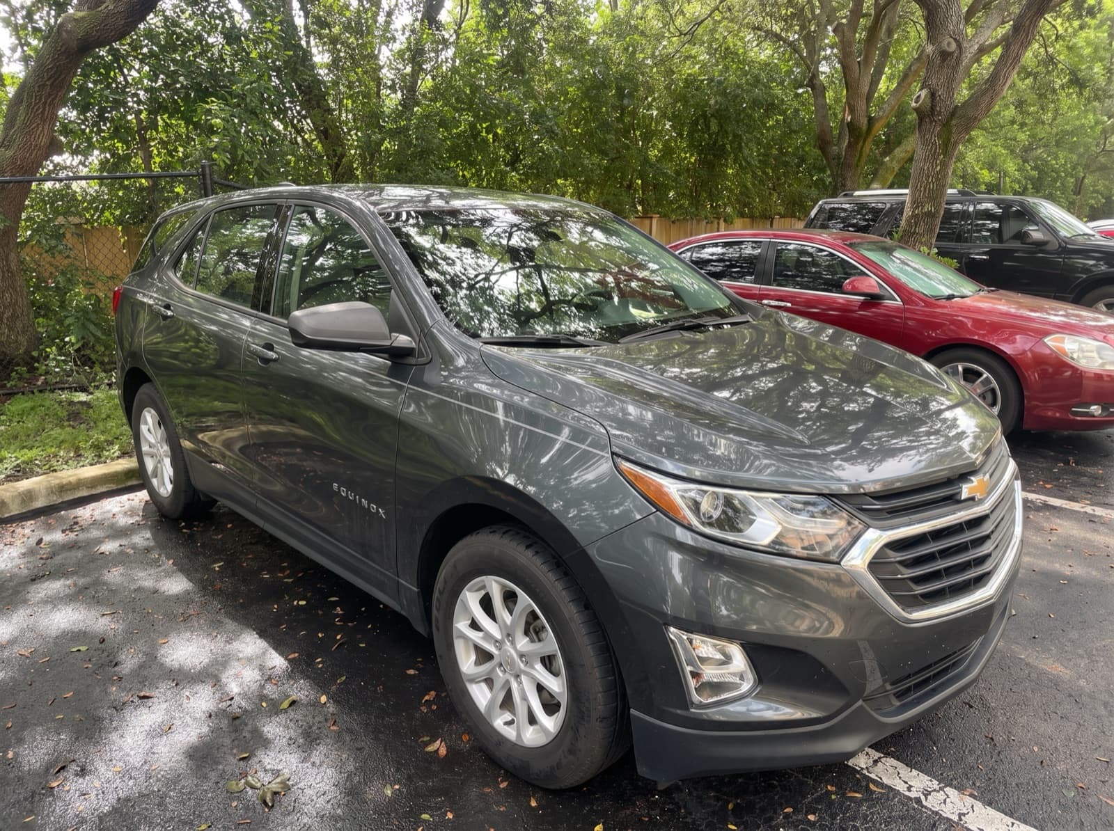 A grey compact SUV in a parking lot in Pembroke Pines, FL, after a Bang AutoGlass mobile glass job
